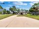Wide view of the home's exterior and extended driveway, showcasing its curb appeal and spacious yard at 3344 Blythe Ave, Spring Hill, FL 34609
