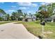 This home features a spacious yard, lengthy driveway, and a welcoming exterior, perfect for Gathering living at 3344 Blythe Ave, Spring Hill, FL 34609