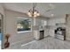 Bright kitchen with white cabinets, stainless steel appliances, and modern backsplash at 3344 Blythe Ave, Spring Hill, FL 34609