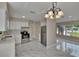 Bright and open kitchen with stainless steel appliances and a seamless backsplash at 3344 Blythe Ave, Spring Hill, FL 34609
