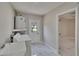 Clean laundry room with washer, dryer, utility sink, and access to the exterior at 3344 Blythe Ave, Spring Hill, FL 34609