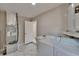 Laundry room features washer, dryer, utility sink, and access to HVAC systems at 3344 Blythe Ave, Spring Hill, FL 34609
