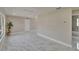 Open-concept living area showcasing modern flooring and neutral paint at 3344 Blythe Ave, Spring Hill, FL 34609