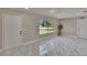 Bright, neutral living space with attractive flooring and large window views at 3344 Blythe Ave, Spring Hill, FL 34609