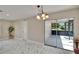 Bright living room with patio access and modern flooring at 3344 Blythe Ave, Spring Hill, FL 34609
