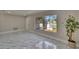 Open floor plan with neutral walls and large windows at 3344 Blythe Ave, Spring Hill, FL 34609