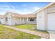 Well-maintained exterior with walkway leading to the front door at 3431 Springfield Dr, Holiday, FL 34691