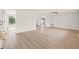 Bright, airy living room with new floors, leading to kitchen and backyard with lake views at 3431 Springfield Dr, Holiday, FL 34691