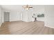 Open living space with new floors, leading to the adjacent kitchen with modern appliances at 3431 Springfield Dr, Holiday, FL 34691
