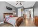 Cozy bedroom with hardwood floors, gray walls, and unique decor at 3611 W Royal Palm Cir, Tampa, FL 33629
