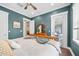 Cozy bedroom with wooden accents and access to a private balcony at 3611 W Royal Palm Cir, Tampa, FL 33629