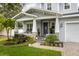 Charming front porch with stone accents, lush landscaping, and a welcoming entrance at 3611 W Royal Palm Cir, Tampa, FL 33629
