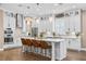 Modern kitchen with stainless appliances, marble counters, island and pendant lighting at 3611 W Royal Palm Cir, Tampa, FL 33629