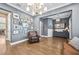Open-concept living area with hardwood floors, elegant decor, and ample space at 3611 W Royal Palm Cir, Tampa, FL 33629