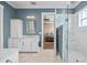 Elegant bathroom featuring marble floors, a shower, and vanity area at 3611 W Royal Palm Cir, Tampa, FL 33629