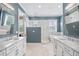 Luxurious bathroom with marble floors, a double vanity, soaking tub, and a glass-enclosed walk-in shower at 3611 W Royal Palm Cir, Tampa, FL 33629