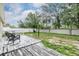 Backyard area with a weathered deck and fence surrounding the perimeter at 3876 Crossline Dr, Spring Hill, FL 34609