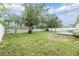 Large backyard featuring a white fence and a small deck, perfect for outdoor entertaining at 3876 Crossline Dr, Spring Hill, FL 34609