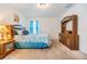 Relaxing bedroom featuring matching nightstands and furniture, as well as a plush bed with blue floral accents at 3876 Crossline Dr, Spring Hill, FL 34609