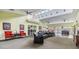 Inviting clubhouse interior with comfortable seating and a view of the pool area at 3876 Crossline Dr, Spring Hill, FL 34609