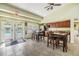 Clubhouse kitchen with tables, chairs, and a view of the pool at 3876 Crossline Dr, Spring Hill, FL 34609