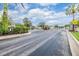 Gated community entrance with lush landscaping and a 20 MPH speed limit sign at 3876 Crossline Dr, Spring Hill, FL 34609