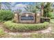 The Windance community sign is beautifully landscaped with stone accents at 3876 Crossline Dr, Spring Hill, FL 34609