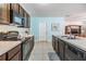 Well-equipped kitchen with modern appliances, plenty of cabinet space, and a functional layout perfect for cooking at 3876 Crossline Dr, Spring Hill, FL 34609
