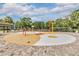 This community splash pad has a fun water features, and a brick deck with tables and chairs at 3876 Crossline Dr, Spring Hill, FL 34609