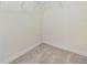 Empty walk-in closet with carpeted flooring and metal shelving perfect for customization and organization at 3876 Crossline Dr, Spring Hill, FL 34609