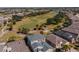 Aerial view of the home and community overlooking a beautiful golf course and mature landscaping at 445 Noble Faire Dr, Sun City Center, FL 33573