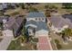 Bird's eye view of a suburban home surrounded by greenery at 445 Noble Faire Dr, Sun City Center, FL 33573