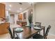 Dining area with an archway leading to the kitchen, and seating for four at 445 Noble Faire Dr, Sun City Center, FL 33573