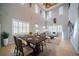 Elegant dining room showcasing high ceilings, multiple windows, and stylish decor at 445 Noble Faire Dr, Sun City Center, FL 33573