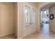 Inviting foyer with decorative double doors leading to a spacious living area at 445 Noble Faire Dr, Sun City Center, FL 33573