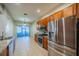 Open kitchen featuring stainless steel appliances, tile floors and granite countertops at 445 Noble Faire Dr, Sun City Center, FL 33573