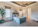 Bedroom featuring tray ceilings, ceiling fan, and carpeted flooring at 445 Noble Faire Dr, Sun City Center, FL 33573