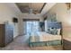 Bedroom featuring tray ceilings, ceiling fan, and carpeted flooring at 445 Noble Faire Dr, Sun City Center, FL 33573