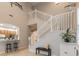 Stairwell with white railings offering a view of the kitchen with a breakfast bar at 445 Noble Faire Dr, Sun City Center, FL 33573