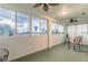 Sunroom featuring floor-to-ceiling windows overlooking a golf course and patio set at 445 Noble Faire Dr, Sun City Center, FL 33573