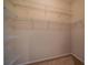 Walk-in closet featuring shelving for organizing clothing and accessories at 445 Noble Faire Dr, Sun City Center, FL 33573