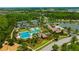 Stunning aerial shot of community amenities, including a pool, playground, tennis courts, and a gathering place at 4551 Barletta Ct, Wesley Chapel, FL 33543