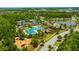 Community pool with tennis courts, playground, and serene lake with lush landscaping at 4551 Barletta Ct, Wesley Chapel, FL 33543