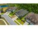 Aerial view of a home, showcasing lush landscaping, a well-maintained lawn and beautiful neighborhood at 4551 Barletta Ct, Wesley Chapel, FL 33543