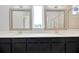 Bright bathroom with double vanity, stone countertops, and a view of shower at 4551 Barletta Ct, Wesley Chapel, FL 33543