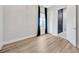 Bedroom with hardwood floors and modern light fixture at 4551 Barletta Ct, Wesley Chapel, FL 33543