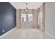 Dining room boasting modern light fixture and windows at 4551 Barletta Ct, Wesley Chapel, FL 33543
