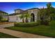 Charming two-story home at dusk, with landscaped yard at 4551 Barletta Ct, Wesley Chapel, FL 33543