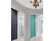 Hallway with a view to bathroom with a shower, showcasing tiled floors and a neutral-toned wall palette at 4551 Barletta Ct, Wesley Chapel, FL 33543