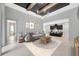 Beautifully decorated living room with neutral tones, modern furniture and flows into open kitchen with barstool seating at 4551 Barletta Ct, Wesley Chapel, FL 33543
